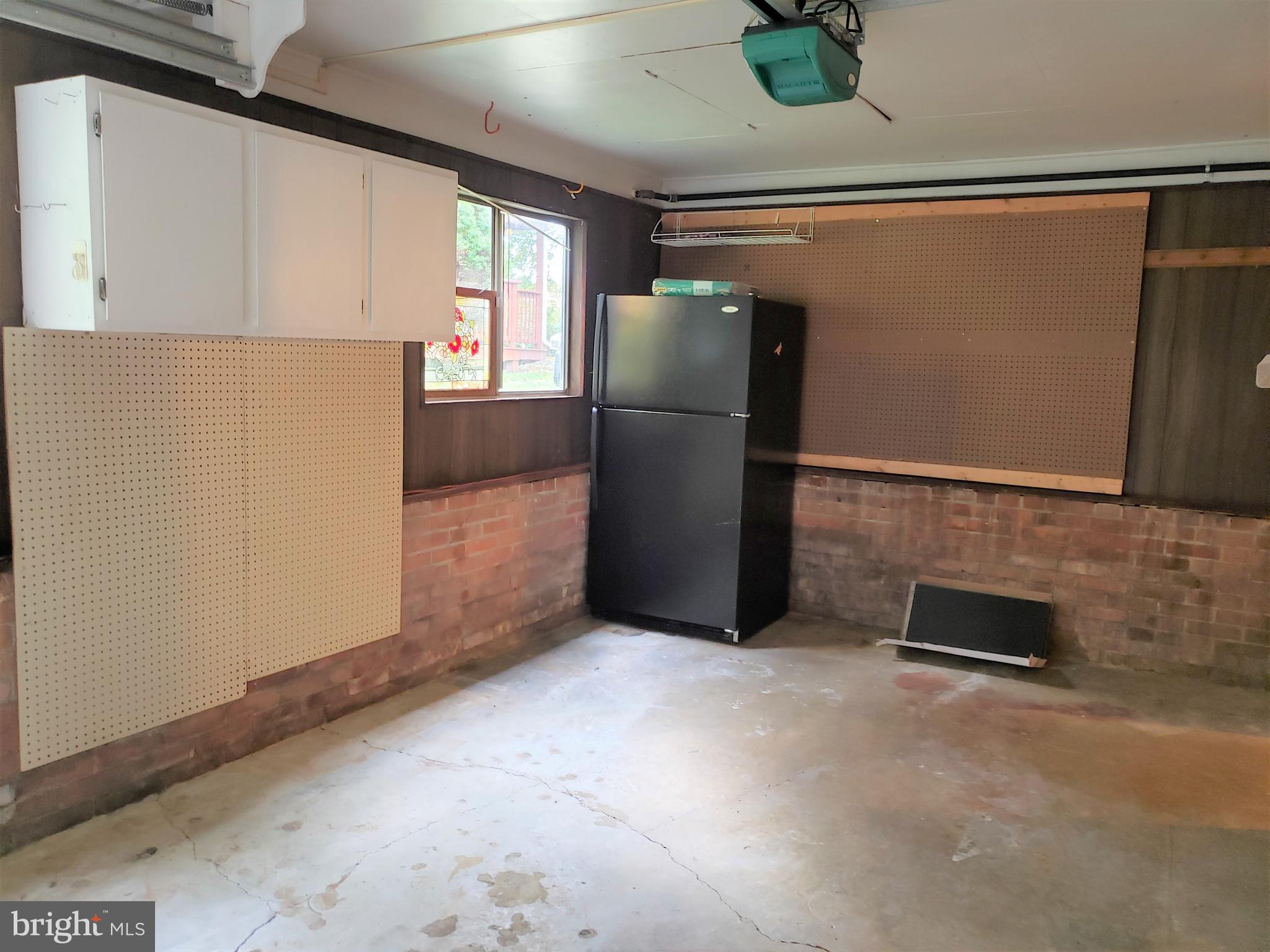 11510 Englewood Road Hagerstown, MD 21740 - Photo 32 of 35 Garage with storage & 2nd Refrigerator