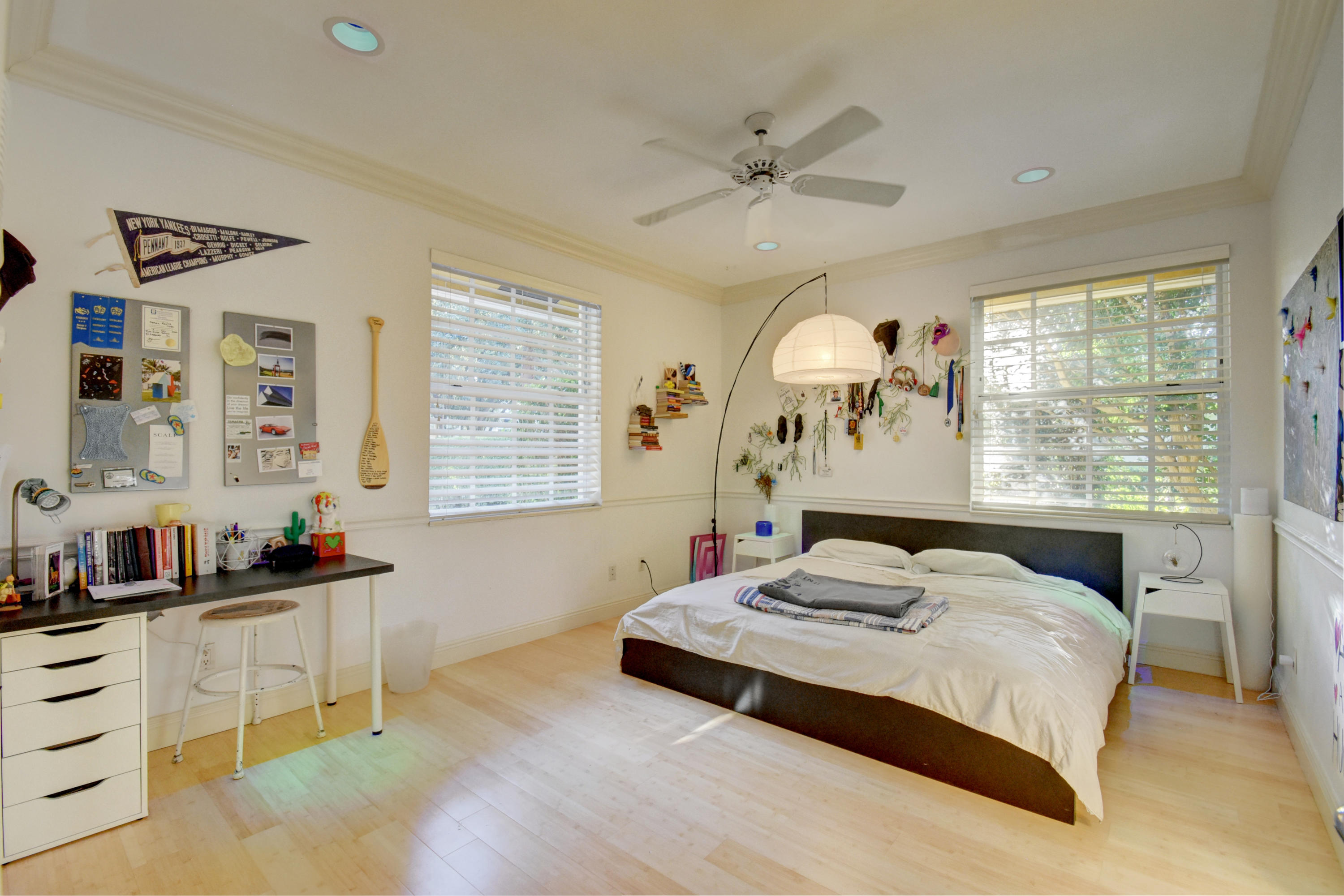 2375 Northwest 41st Street Boca Raton, FL 33431 - Photo 18 of 38 a bedroom with a bed and a chandelier