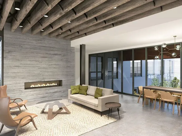 a living room with furniture and outdoor view