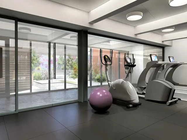 a room with furniture and large windows