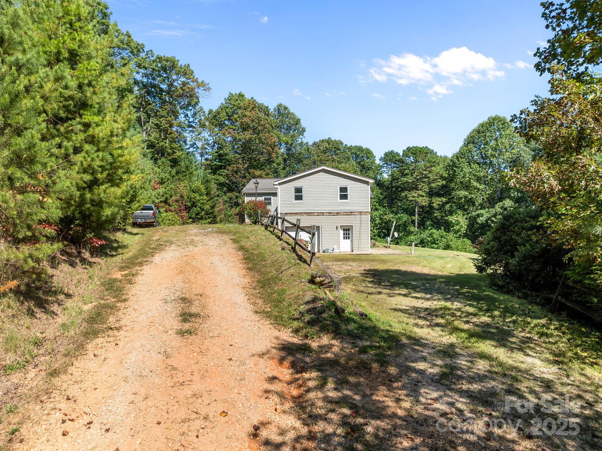 473 Eli Capps Road Zirconia, NC 28790 - Photo 11 of 37 a view of a house with a yard