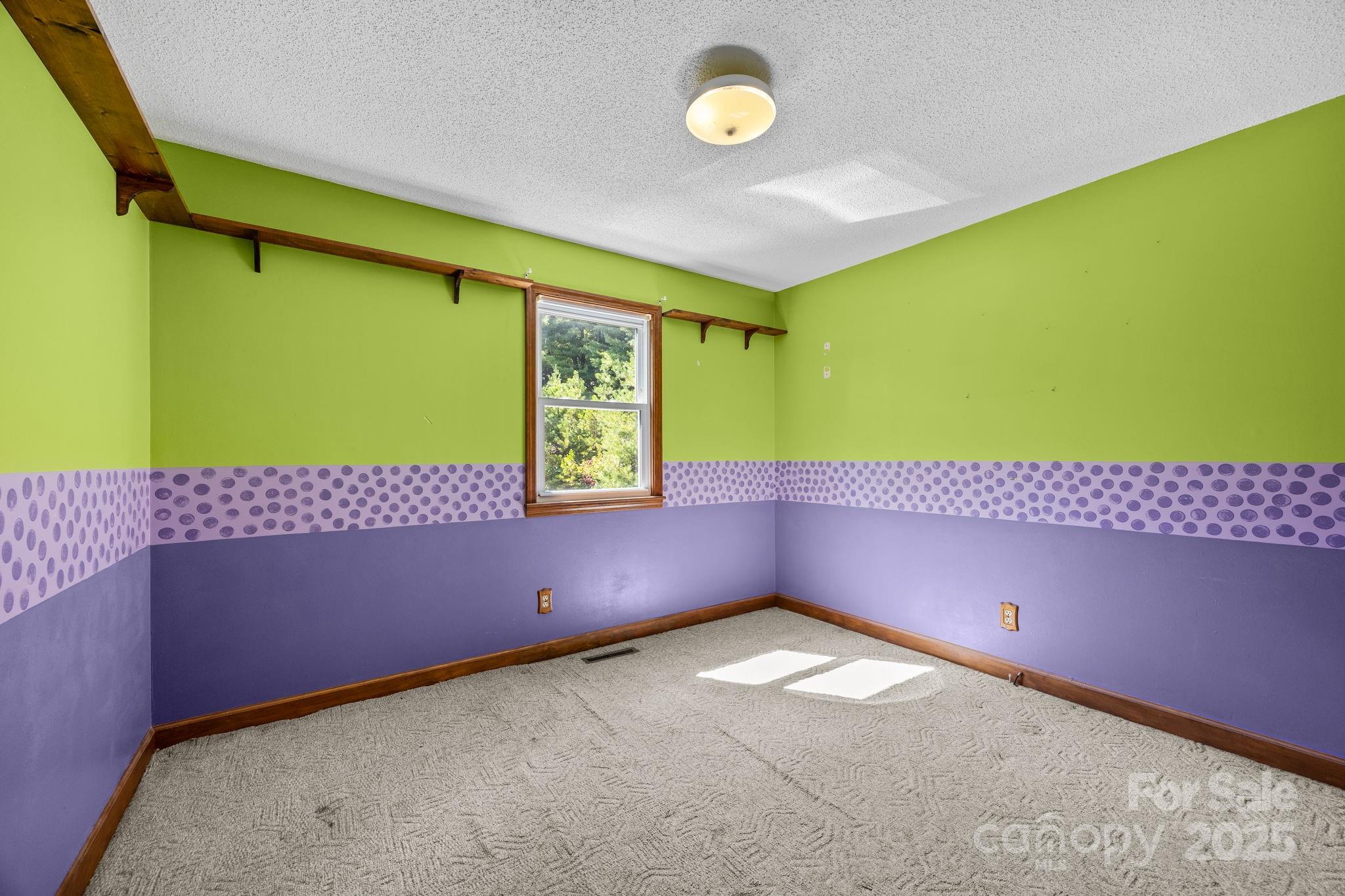 473 Eli Capps Road Zirconia, NC 28790 - Photo 30 of 37 a view of an empty room with a window