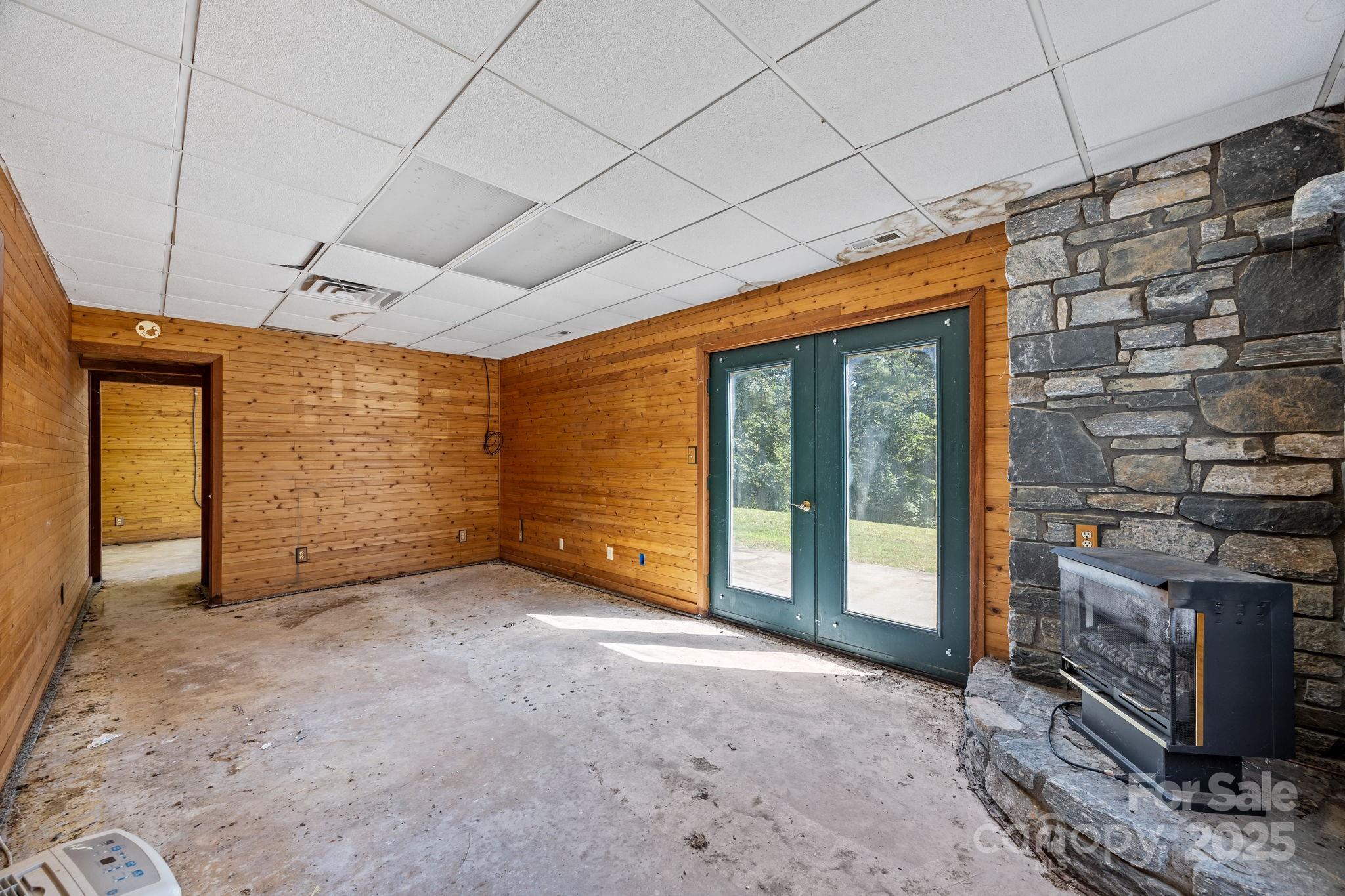 473 Eli Capps Road Zirconia, NC 28790 - Photo 33 of 37 a view of an empty room with a fireplace