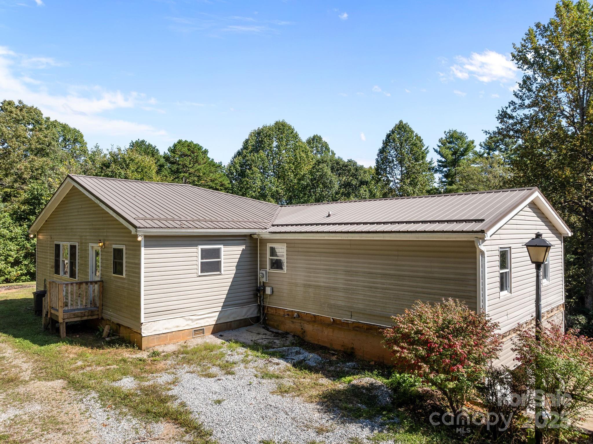 473 Eli Capps Road Zirconia, NC 28790 - Photo 7 of 37 a view of a house with a backyard