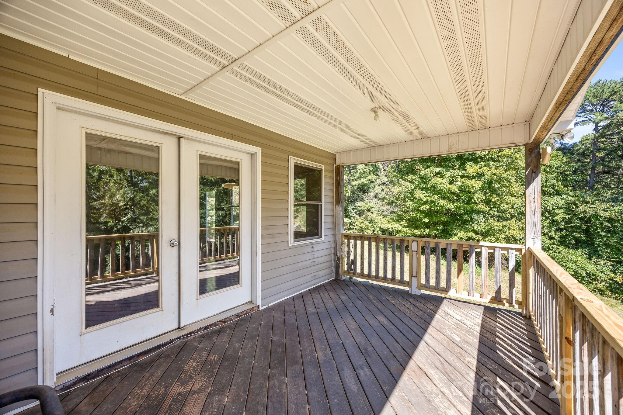 473 Eli Capps Road Zirconia, NC 28790 - Photo 8 of 37 a view of a two chairs in the balcony