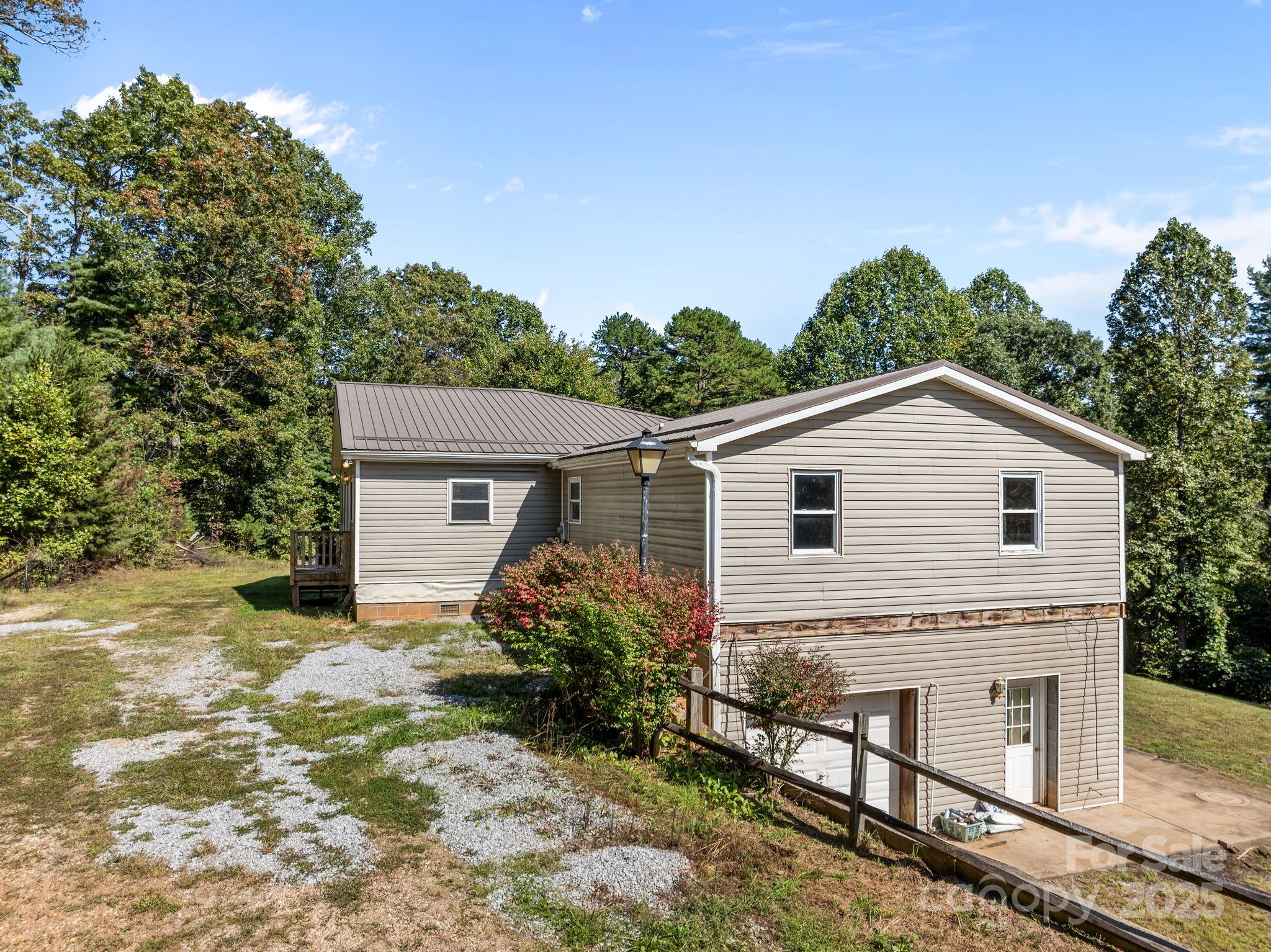 473 Eli Capps Road Zirconia, NC 28790 - Photo 10 of 37 a view of a house with a yard