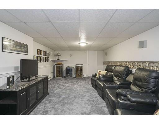 34 Century Drive Canton, MA 02021 - Photo 19 of 21 a living room with furniture and a flat screen tv