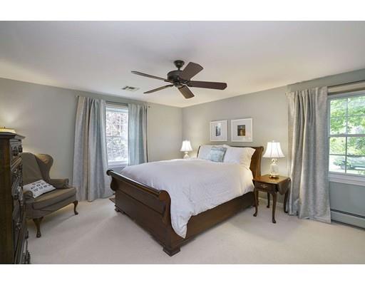 34 Century Drive Canton, MA 02021 - Photo 9 of 21 a bedroom with a bed and a chandelier