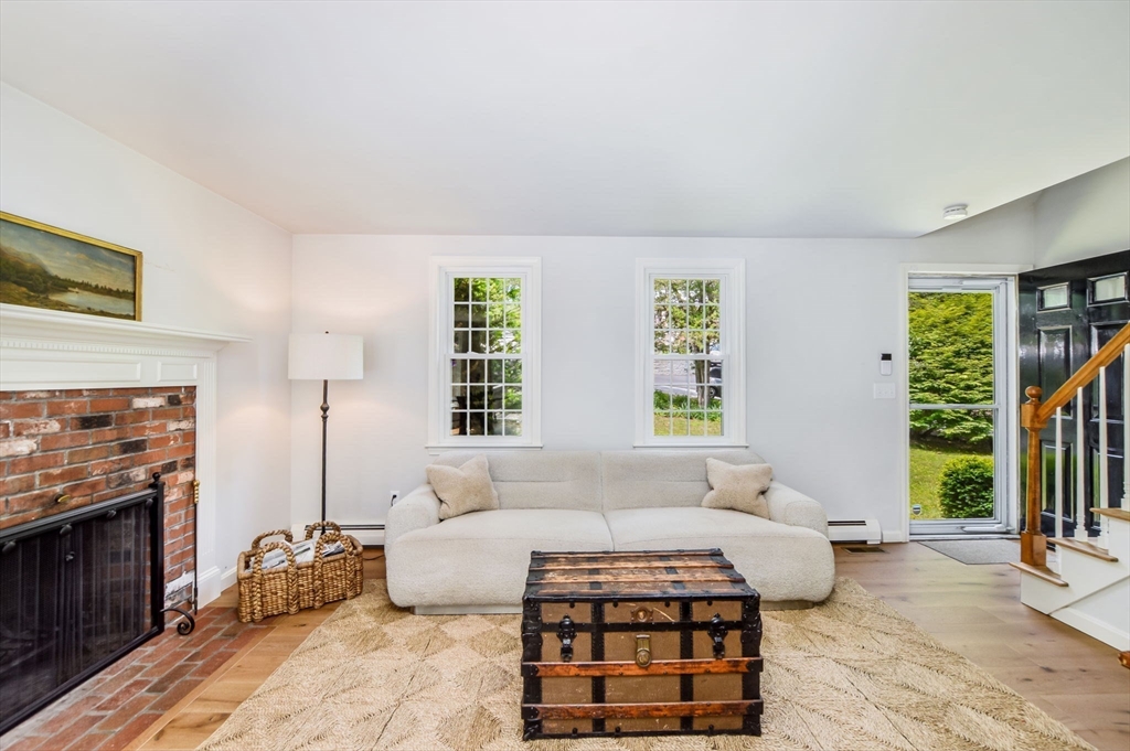 44 Buccaneer Way Mashpee, MA 02649 - Photo 13 of 39 a bedroom with furniture and a fireplace