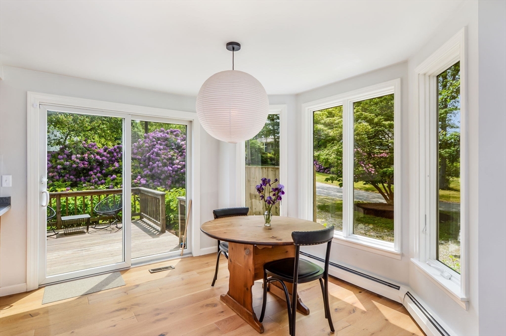 44 Buccaneer Way Mashpee, MA 02649 - Photo 16 of 39 a view of a dining room with furniture window and wooden floor