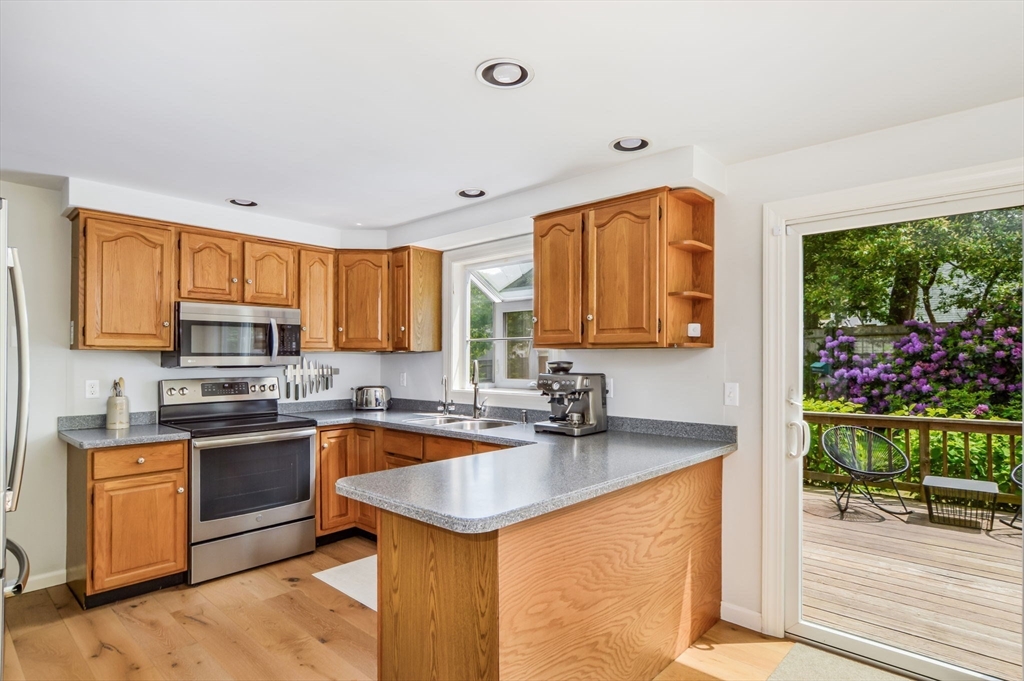 44 Buccaneer Way Mashpee, MA 02649 - Photo 18 of 39 a kitchen with a sink a stove and cabinets