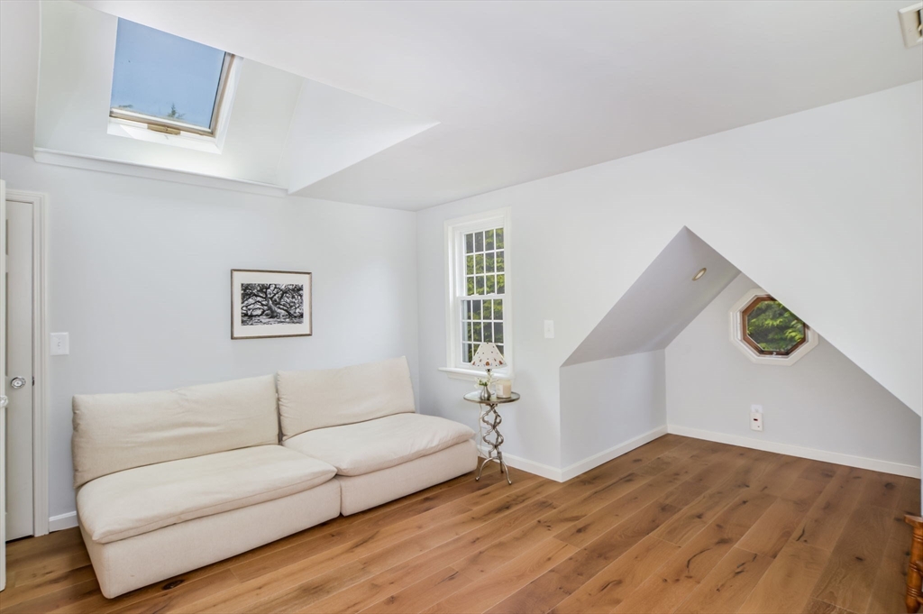 44 Buccaneer Way Mashpee, MA 02649 - Photo 29 of 39 a living room with furniture and a wooden floor