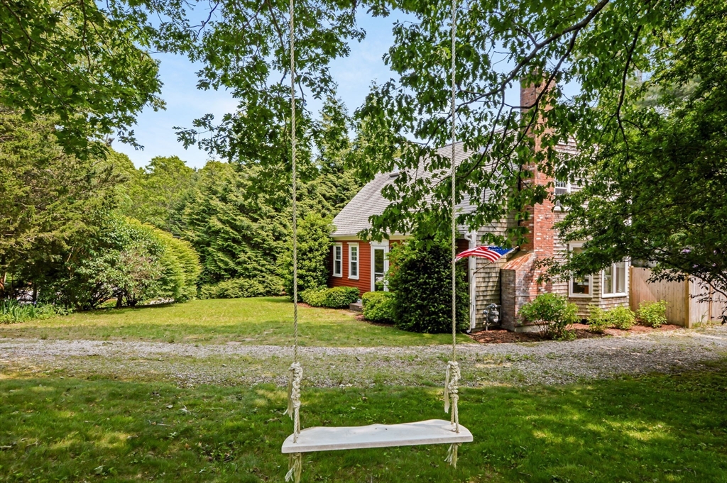 44 Buccaneer Way Mashpee, MA 02649 - Photo 4 of 39 a front view of a house with a yard