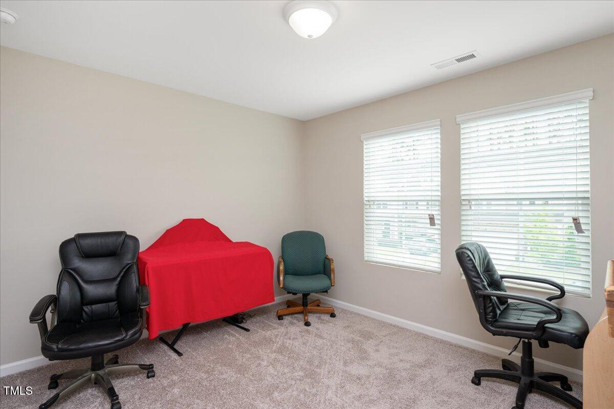 1416 Southpoint Trail Durham, NC 27713 - Photo 20 of 26 a livingroom with workspace and a window
