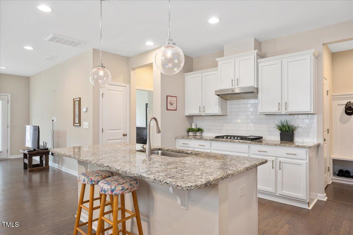 1416 Southpoint Trail Durham, NC 27713 - Photo 5 of 26 a kitchen with stainless steel appliances granite countertop a sink a stove and cabinets