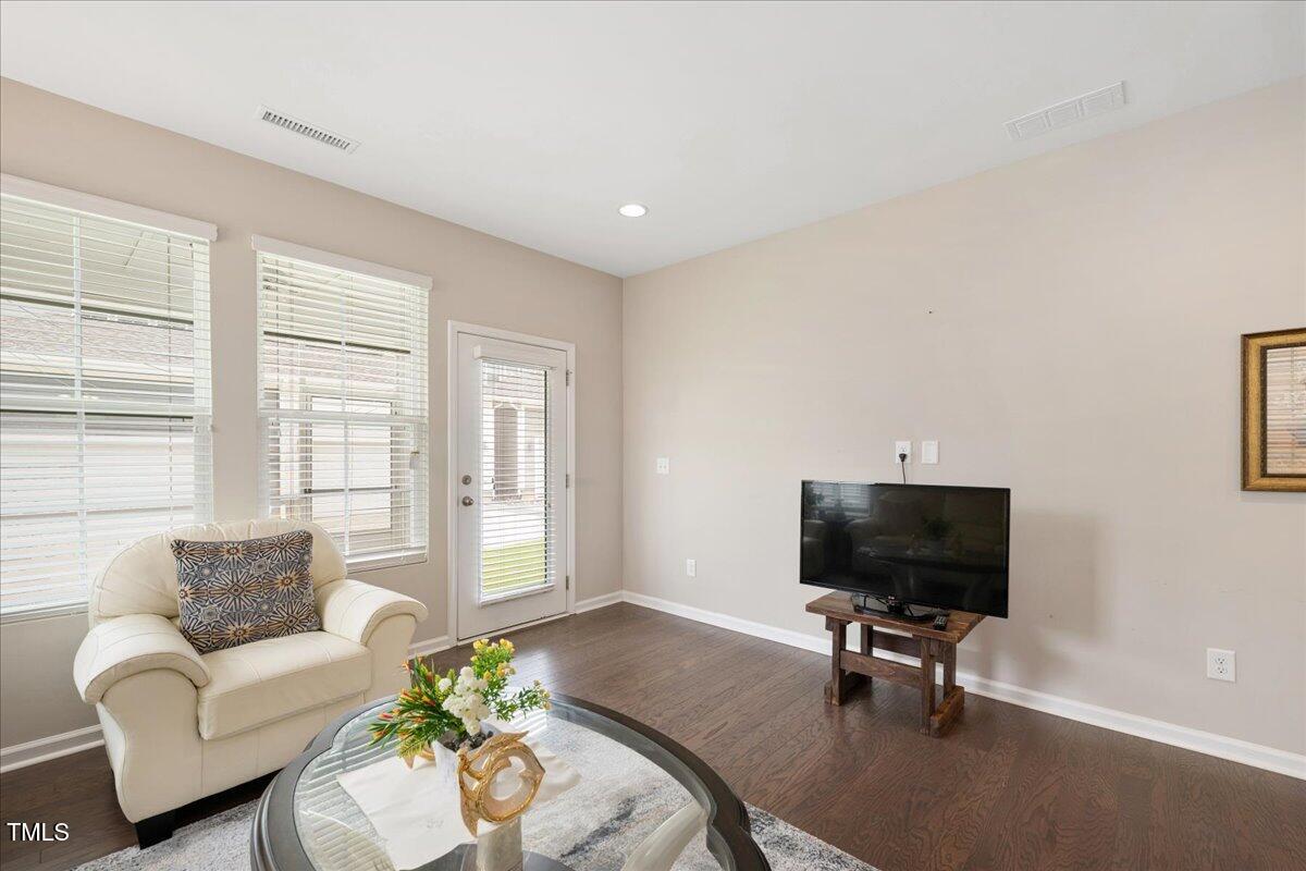 1416 Southpoint Trail Durham, NC 27713 - Photo 9 of 26 a living room with furniture and a flat screen tv