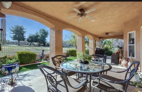 a view of a patio with furniture