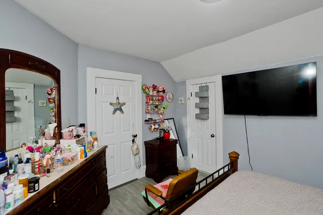 a room with furniture and flat screen tv