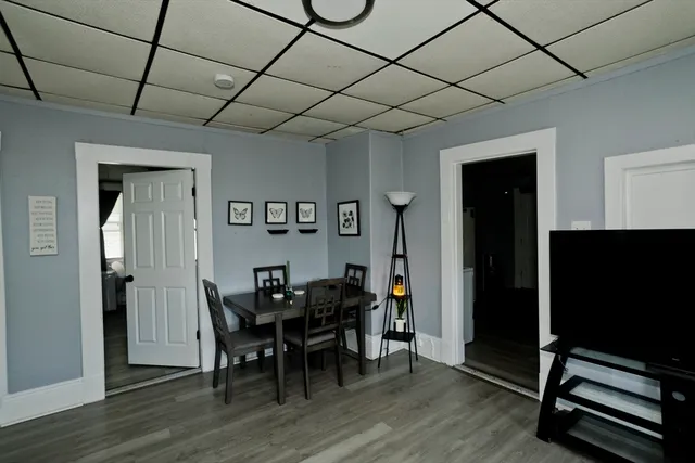 a view of a dining room with furniture and wooden floor