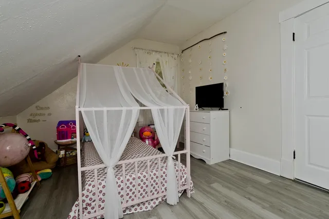a view of a room with shelves windows and white walls