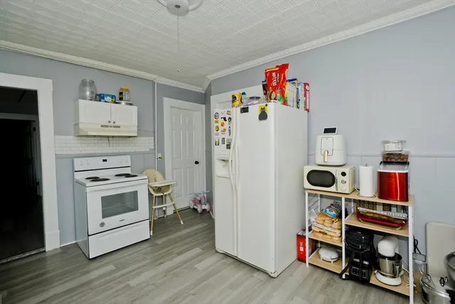 a room with furniture and wooden floor