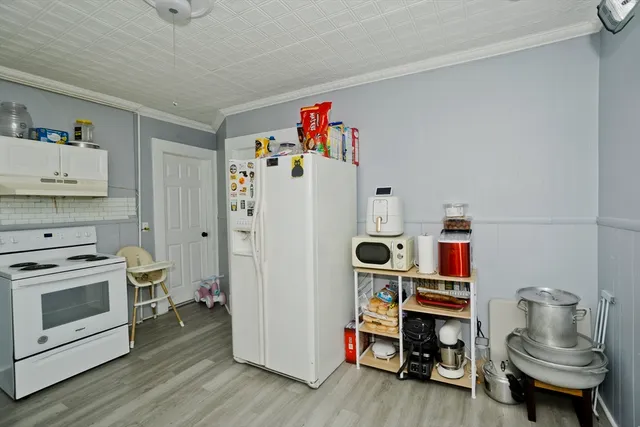 a room with furniture and a wooden floor