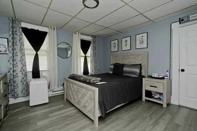 a bed room with a bed and a television