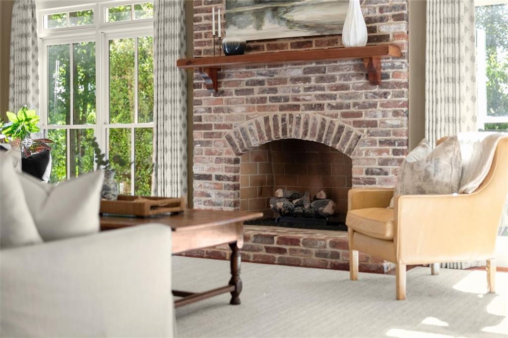 1450 Acworth Due West Road Northwest Kennesaw, GA 30152 - Photo 26 of 77 a living room with furniture and a fireplace