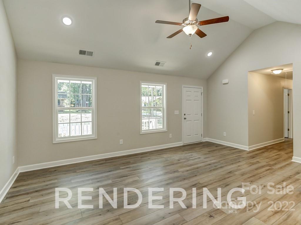 188 Washington Street York, SC 29745 - Photo 11 of 46 a view of an empty room and window and chandelier fan