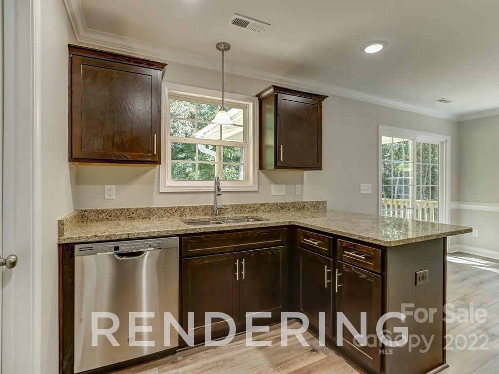 188 Washington Street York, SC 29745 - Photo 18 of 46 a kitchen with granite countertop a sink and a stove