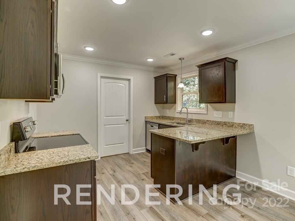 188 Washington Street York, SC 29745 - Photo 19 of 46 a kitchen with stainless steel appliances granite countertop a sink stove and refrigerator