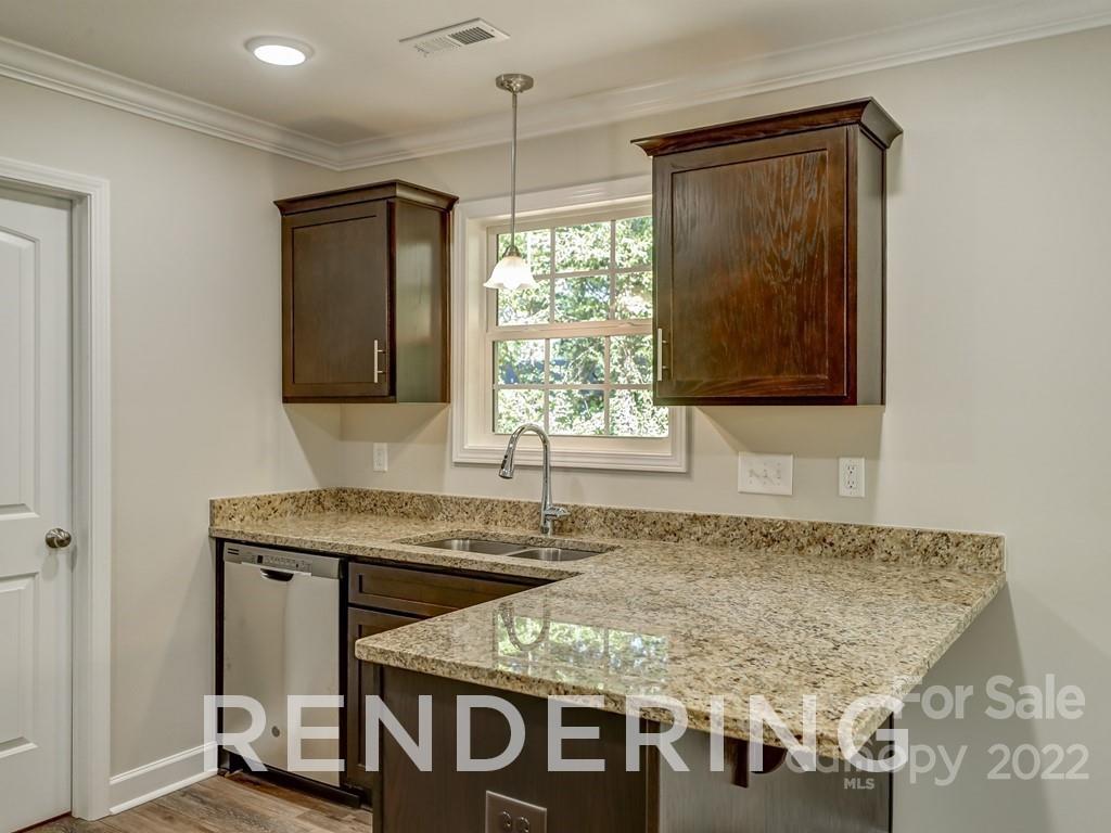 188 Washington Street York, SC 29745 - Photo 20 of 46 a bathroom with a granite countertop sink and a mirror