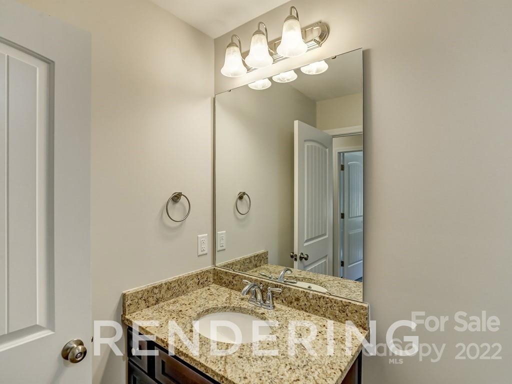 188 Washington Street York, SC 29745 - Photo 29 of 46 a bathroom with a granite countertop sink a mirror and a shower