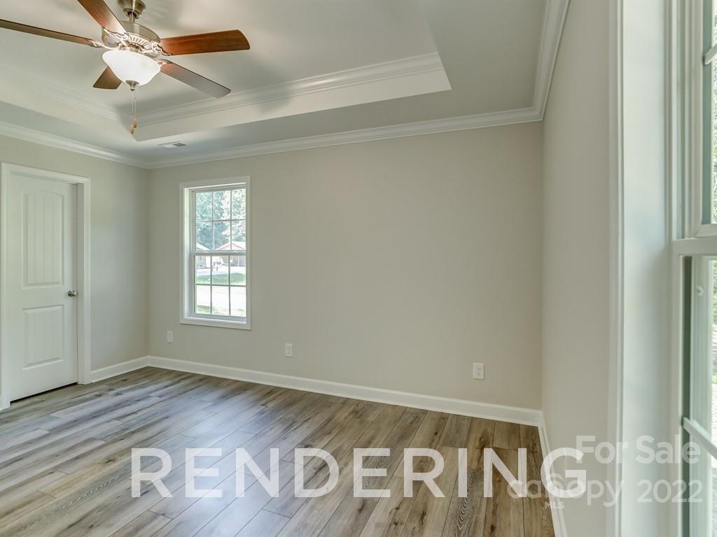 188 Washington Street York, SC 29745 - Photo 37 of 46 a view of an empty room with wooden floor and a window