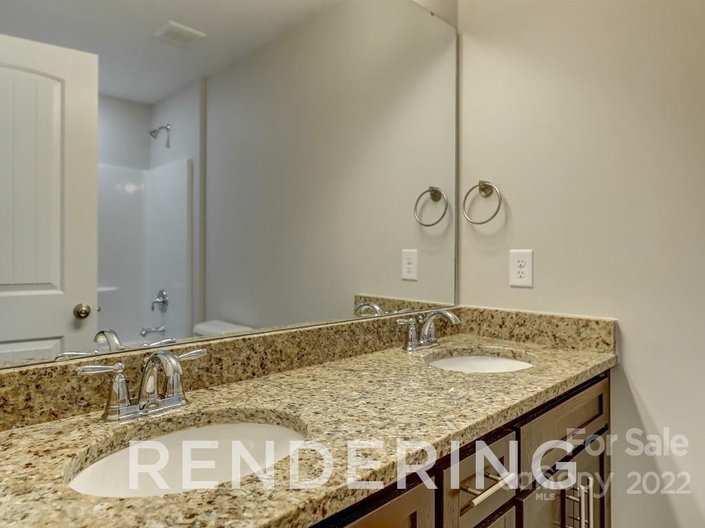 188 Washington Street York, SC 29745 - Photo 39 of 46 a bathroom with a granite countertop sink and a mirror