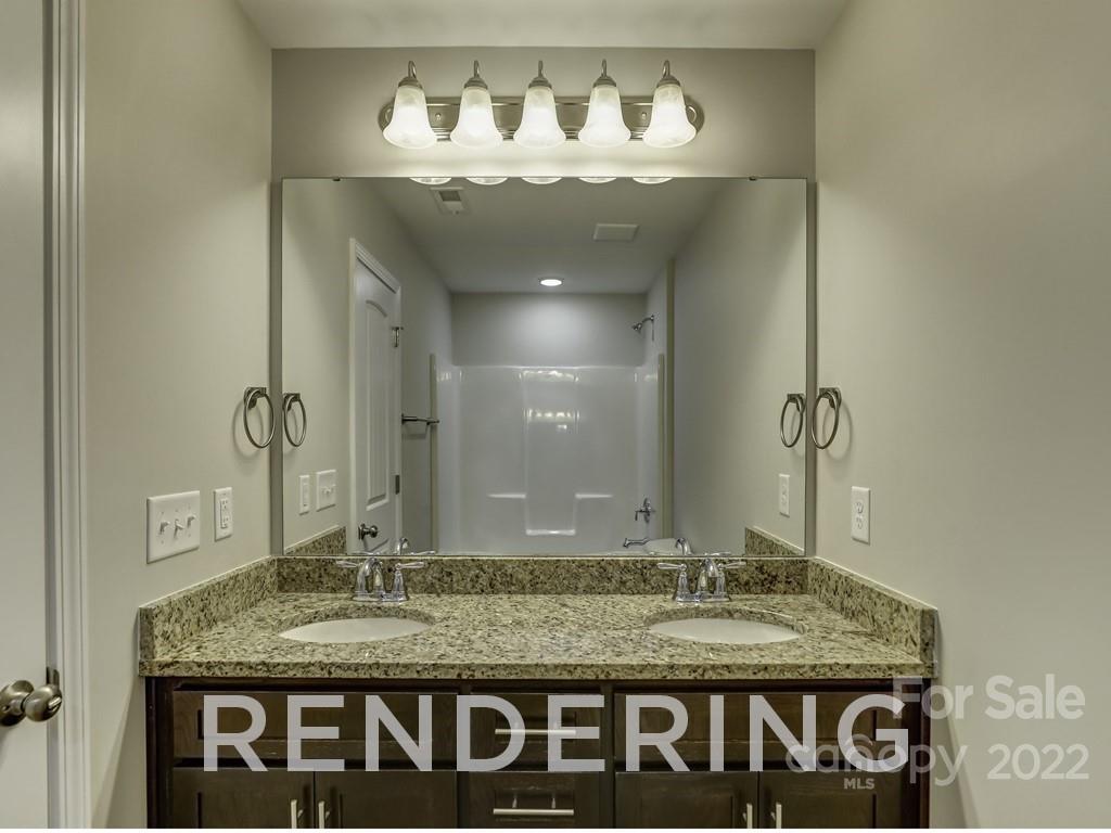 188 Washington Street York, SC 29745 - Photo 40 of 46 a bathroom with a granite countertop sink and a mirror