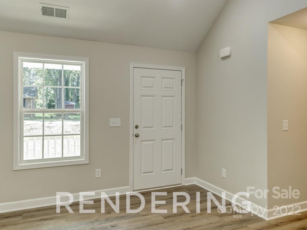 188 Washington Street York, SC 29745 - Photo 8 of 46 a view of a livingroom with wooden floor and a sink