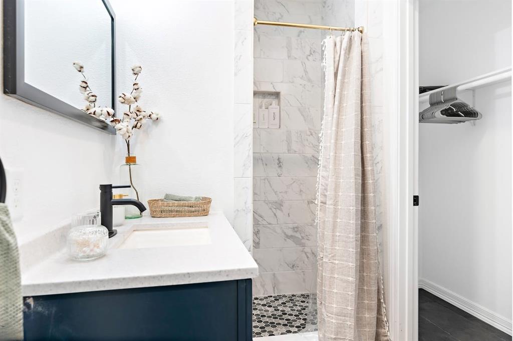 3210 Edna Avenue Waco, TX 76708 - Photo 12 of 18 a bathroom with a sink vanity and a mirror
