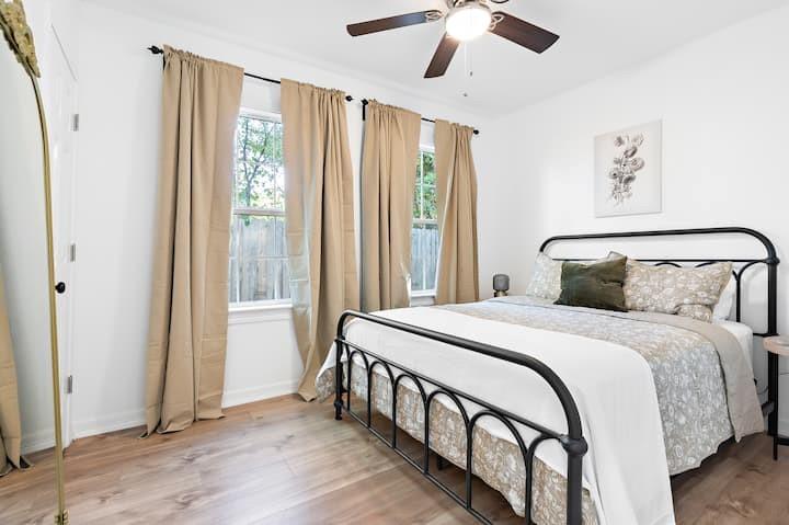 3210 Edna Avenue Waco, TX 76708 - Photo 10 of 18 a bedroom with a bed and wooden floor
