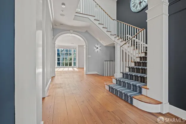 a bathroom with a granite countertop double vanity sink and mirror