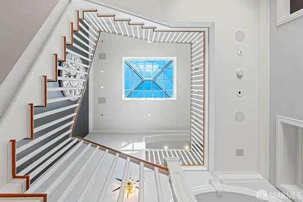 a bathroom with a granite countertop sink a toilet and shower