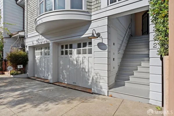 a living room with furniture fireplace and window