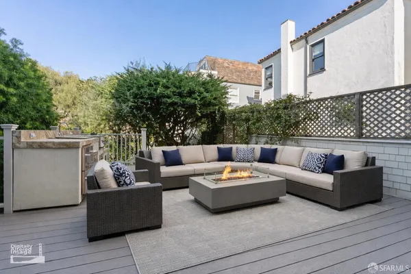 a view of a livingroom with wooden floor and kitchen