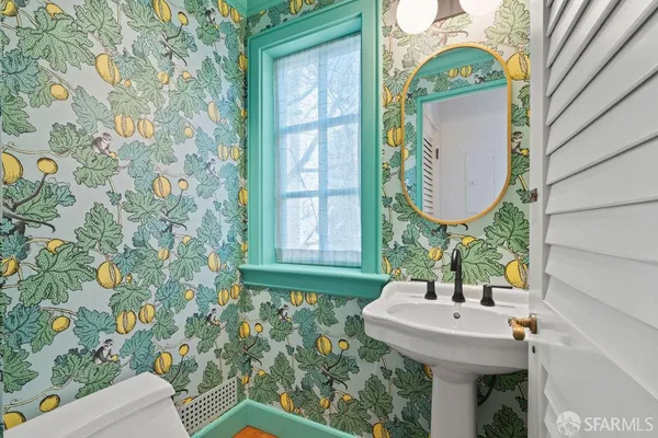 a bathroom with a sink double vanity and a mirror