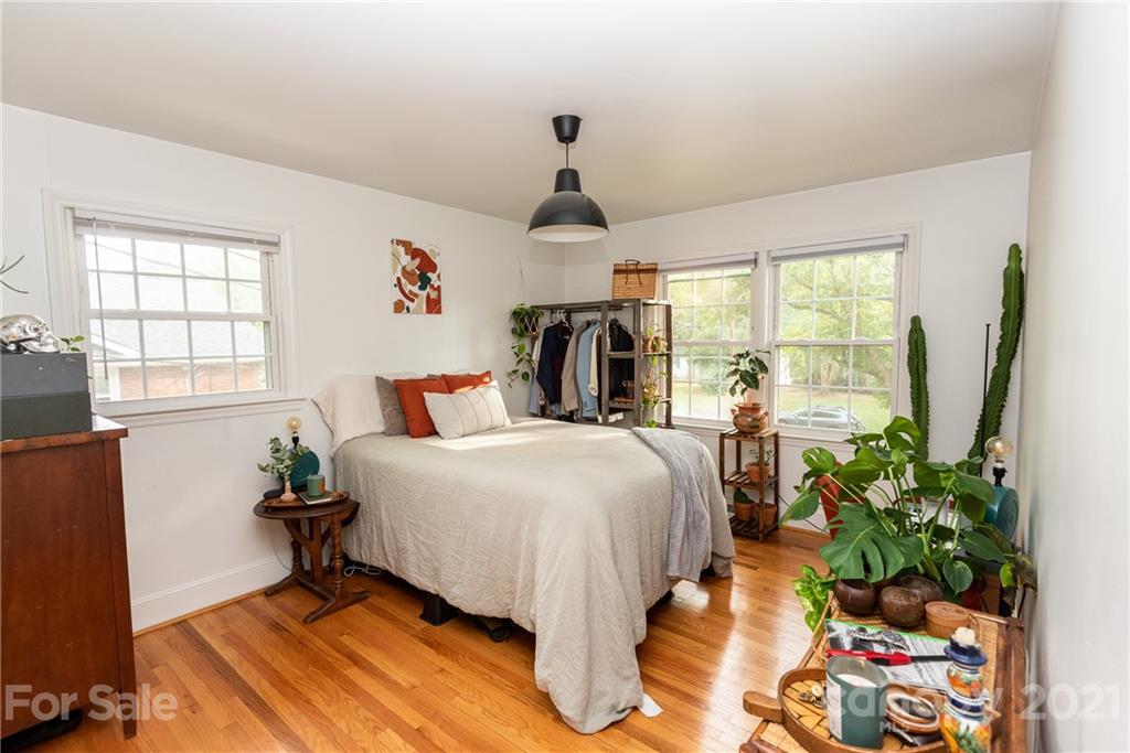 5810 Brookhaven Road Charlotte, NC 28210 - Photo 11 of 16 a bed sitting in a bedroom next to a window