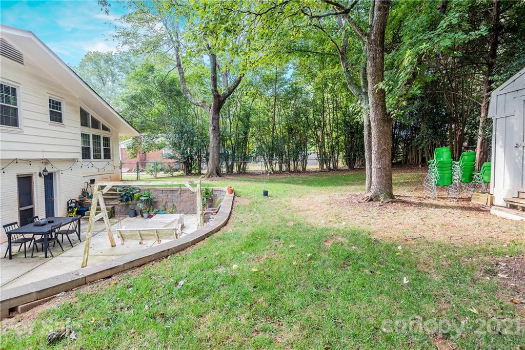 5810 Brookhaven Road Charlotte, NC 28210 - Photo 15 of 16 a view of a house with backyard and sitting area