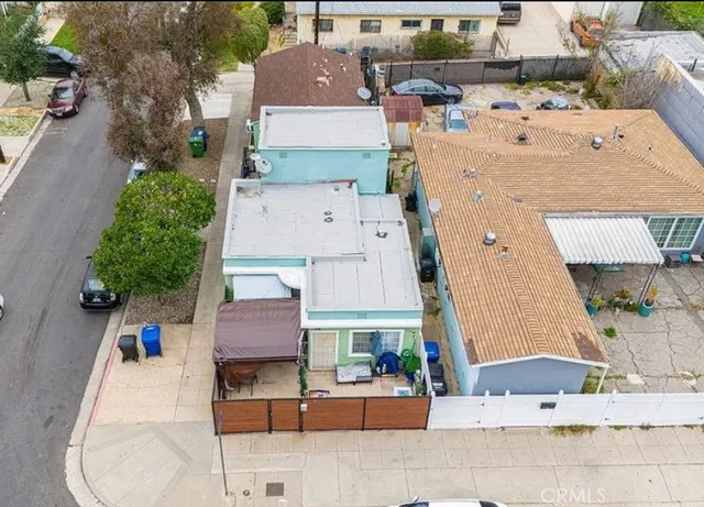 an aerial view of residential houses with outdoor space