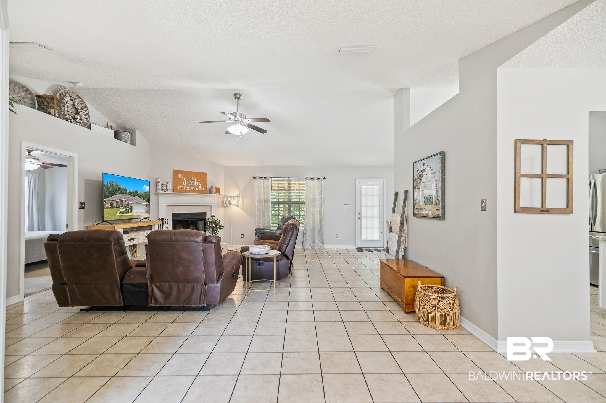 28246 Turkey Branch Drive Daphne, AL 36526 - Photo 6 of 41 Tiled living room featuring ceiling fan and vaulted ceiling