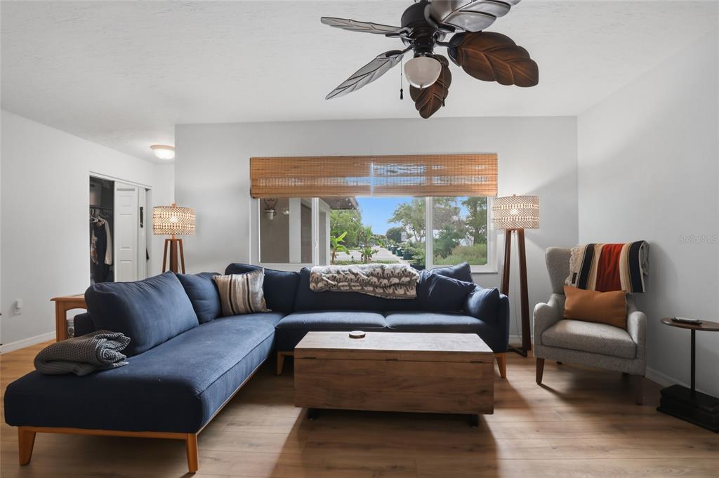4576 Bliss Road Sarasota, FL 34233 - Photo 9 of 40 a living room with furniture and a large window
