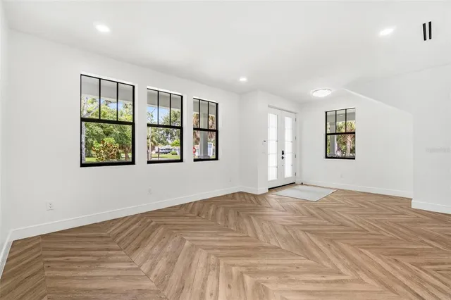 a view of an empty room with a window